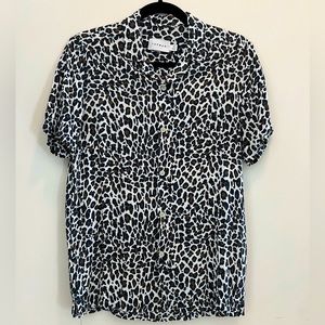 TOPMAN leopard print, short sleeved button down, size XS. Spots are blue/brown